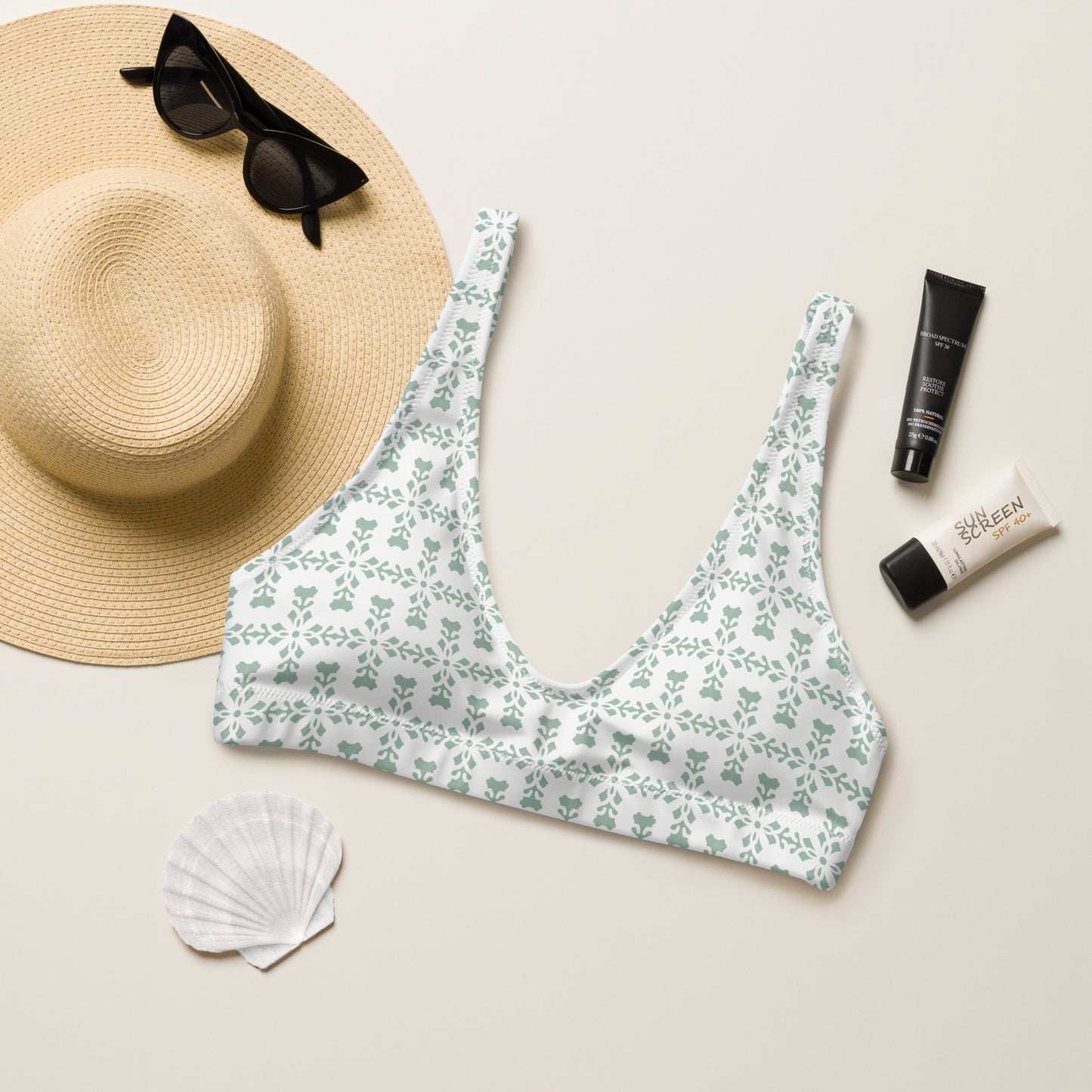 flowers hearts in light green teal on a white bikini top, sun hat, sunglasses and accessories for mockup.