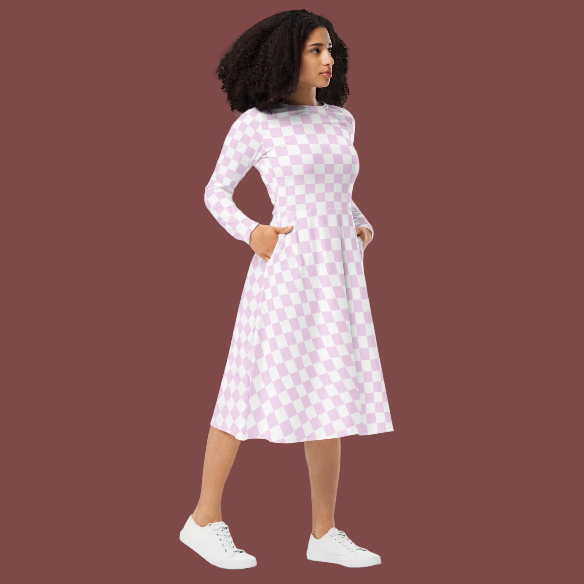 white and pink checkered dress with pockets long sleeved below knee length crew neck