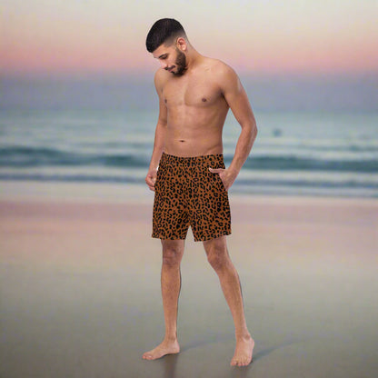 man wearing a brown black cheetah print swimsuit